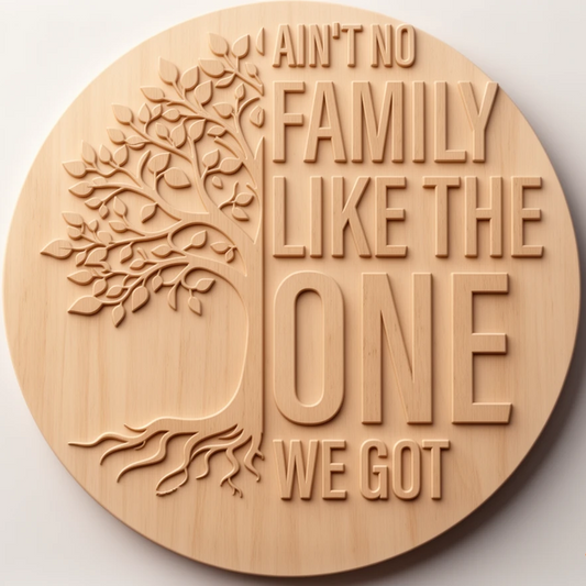 A round wooden plaque with a carved tree and the phrase “I ain’t no family like the one we got” in raised lettering, shown on a plain light background.